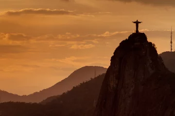 Fotobehang  Silhouette of Christ the Reedemer statue, Corcovado, Rio de Janeiro, Brazil © Matyas Rehak