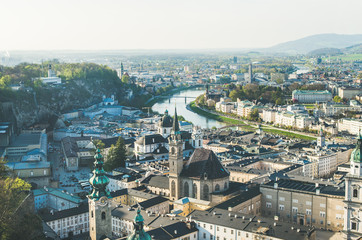 Fototapeta premium Scenic view over old town center of Salzburg, Austria, and the river from castle hill