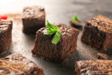 Delicious cocoa brownies on table