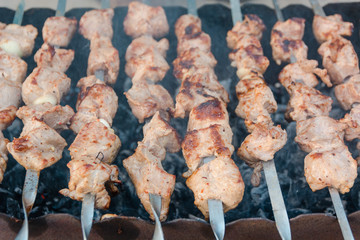 The shish kebab is fried on a brazier. Preparation of a shish kebab.