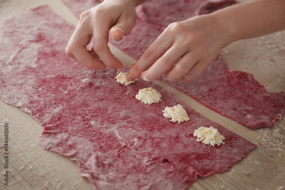 Canvas Prints woman making ravioli on table