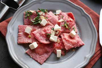 Plate with delicious ravioli, closeup