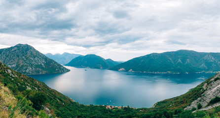 Fototapeta na wymiar The island of Gospa od Skrpela, Kotor Bay, Montenegro. View from the high mountain above Risan.