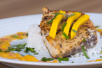 stir fried sea bass with mango cilantro sauce