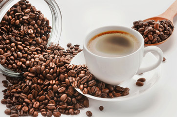 Coffee cup and saucer , coffee beans on a white background.