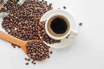 Coffee cup and saucer , coffee beans on a white background.