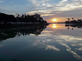 Sunset behind the pond
