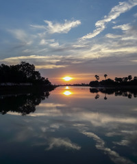 Sunset behind the pond
