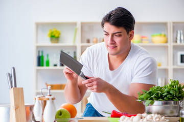 Young male cook working in the kitchen