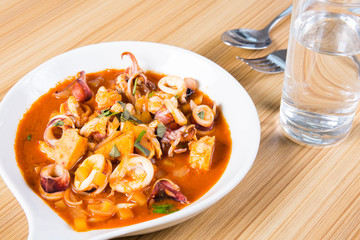 stir fried squid with potato onions and pepper in gochujang sauce