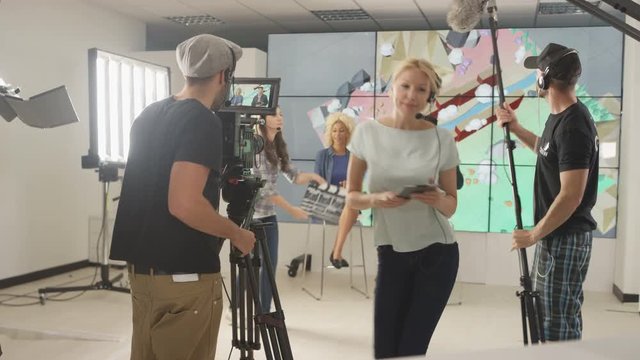 4K TV crew & presenters in studio, preparing to go live on air
