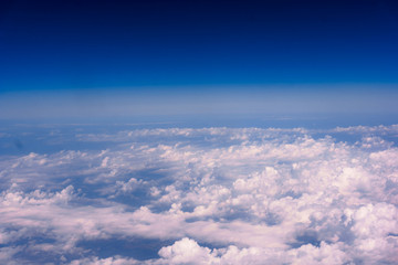 Naklejka na ściany i meble cloudscape background view from airplane Windows
