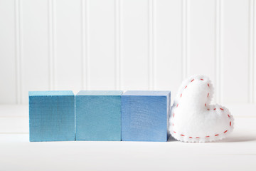 Blue wooden blocks with heart cushion