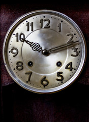 old or retro clock winding, close-up hands and face of the old mechanical watches.