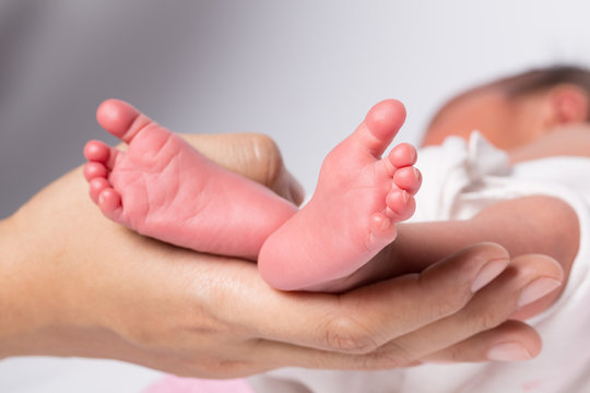 Baby feet in mother hands,The feet of a newborn