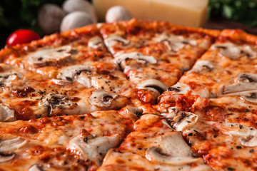 Appetizing hot sliced italian pizza, closeup view. Fast food restaurant menu photo. Traditional meal, unhealthy eating concept