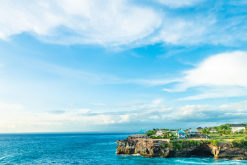 Beach summer with clouds, blue sky and palm tree. Beautiful tropical paradise for holiday and relax copy space background. Bali, Indonesia.