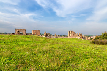 Fototapeta na wymiar Rome, Italy. Ruins of buildings in the antique villa of consuls Quintili, II century