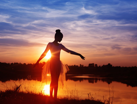 Silhouette of a Ballet Dancer at Sunset Outdoors