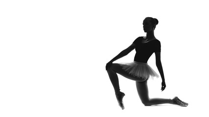 Fototapeta na wymiar Black and white trace of young beautiful ballet dancer isolated on a white background
