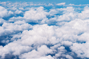 Naklejka na ściany i meble Skyline View above the Clouds from air plane.