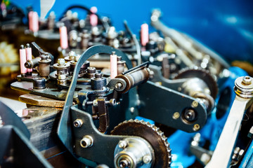 The mechanism of a braiding machine close-up.
