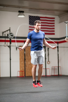 Fit Athletic Young Man Using A Skipping Rope