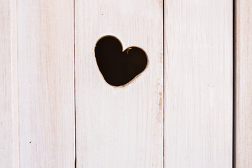 Wooden board with cut out heart shape