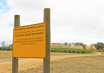 black and yellow Grapevine Pest And Disease Control sign