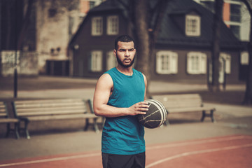 African-american streetball player practicing outdoors