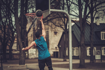 African-american streetball player practicing outdoors