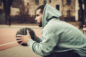 African-american streetball player resting.