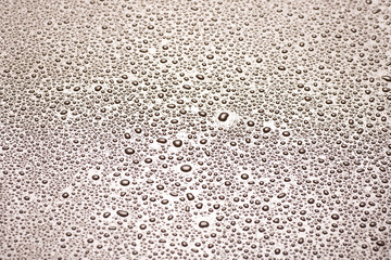 closeup to water drops on glass with lighting background