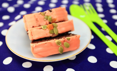 Cake is a piece in a white dish on a point cloth.