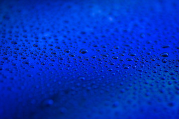 closeup to water drops on glass with lighting background