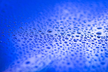 closeup to water drops on glass with lighting background