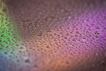 closeup to water drops on glass with lighting background
