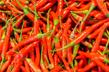 Fresh red chili pepper in the market. For food, kitchen, texture, background and vegetables.