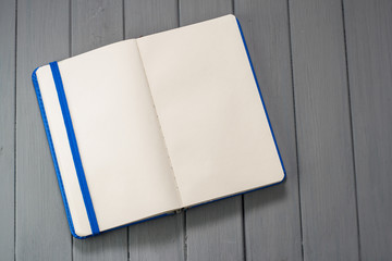 Notepad for recording on a wooden table.