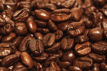 Dark many roasted coffee beans texture background