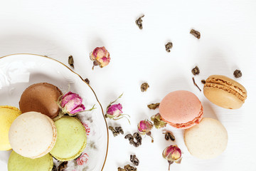 Fototapeta na wymiar Multicoloured macaroons and tea