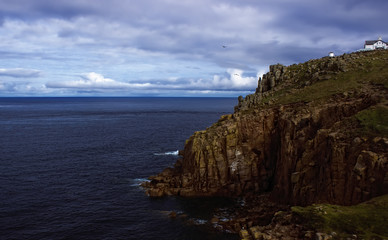 Fototapeta na wymiar Landscape of towering granite cliffs at Lands End Cornwall England UK Europe