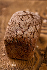 Fresh bread on a wooden background