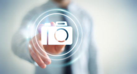 Businessman using modern camera application 3D rendering