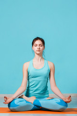 Girl sitting in lotus pose