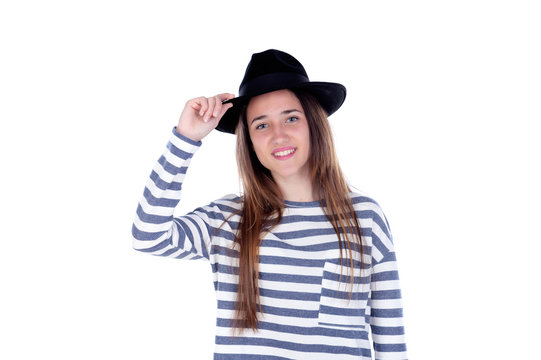 Pretty teenager girl with black hat posing at studio.