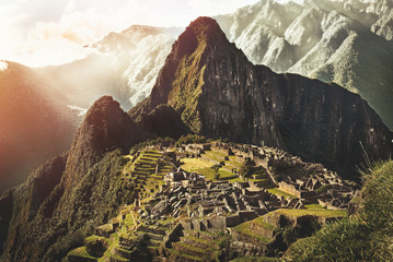 MACHU PICCHU, PERU - MAY 31, 2015: View of the ancient Inca City of Machu Picchu. The 15-th century Inca site.'Lost city of the Incas'. Ruins of the Machu Picchu sanctuary. UNESCO World Heritage site. - obrazy, fototapety, plakaty