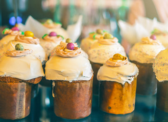 Easter cake, russian and ukrainian traditional kulich, paska Easter bread. Selective focus. Homemade Easter cake with with traditional decoration recipe. Sweet bread, paska, holidays orthodox kulich. 