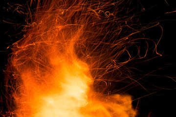 Flame of fire with sparks on a black background