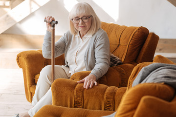 Depressed aged woman grieving about her husband